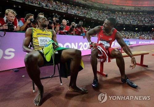 우사인 볼트(왼쪽)와 저스틴 개틀린. (AP=연합뉴스 자료사진)