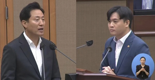 서울시가 청년 남녀의 만남을 주선하는 ‘서울팅’ 추진을 놓고 오세훈(왼쪽) 서울시장이 박강산 더불어민주당 시의원의 질문에 답하고 있다. 서울시의회 홈페이지 캡처