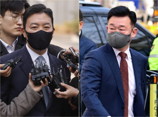 윤석열 대통령 체포 방해 혐의를 받는 김성훈(왼쪽) 대통령경호처 차장과 이광우 경호본부장이 21일 서울 마포구 서울서부지법에서 열린 영장실질심사에 출석하고 있다. 문호남 기자